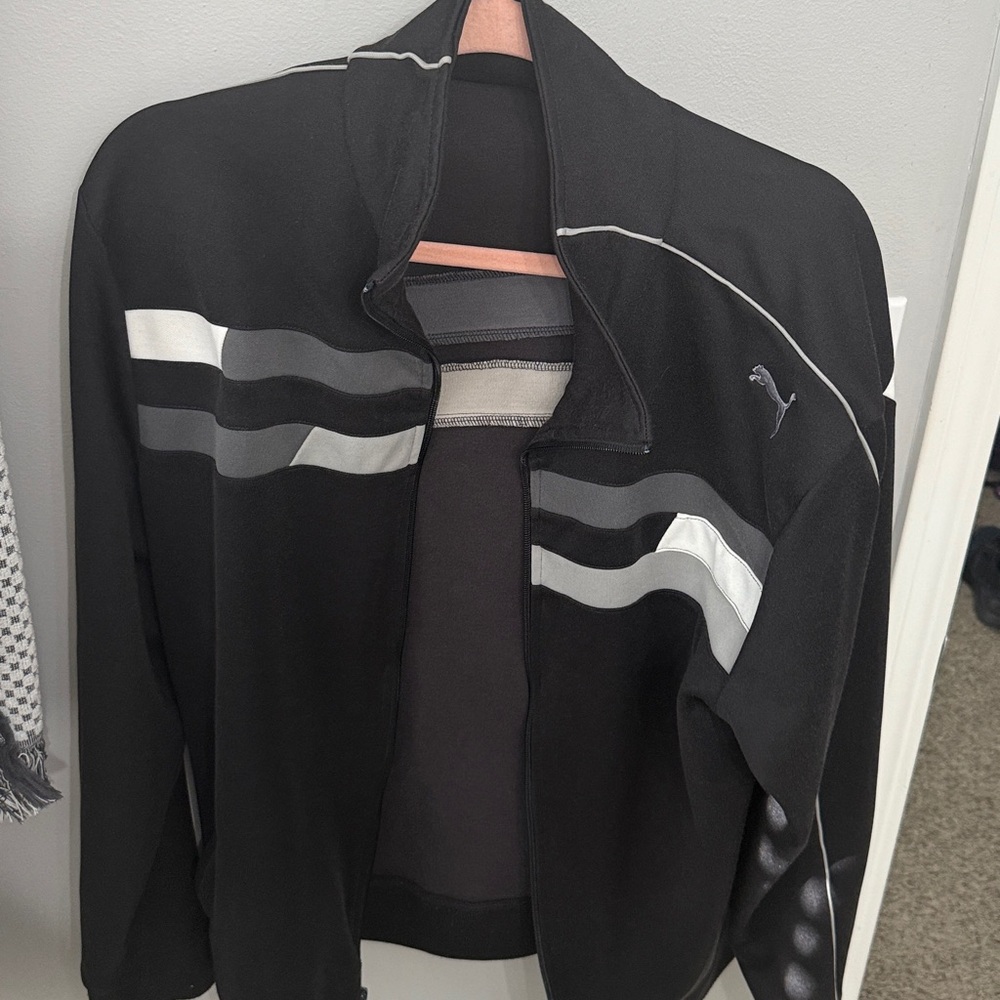 Vintage Puma Black, White, and Gray track jacket.